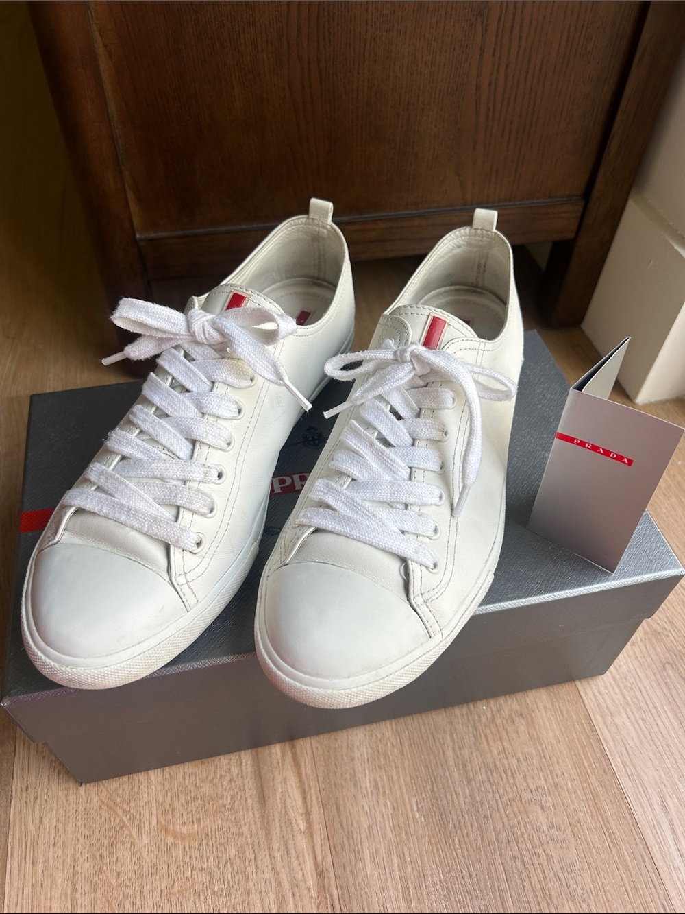 Prada White Leather Sneakers with Red Logo Detail